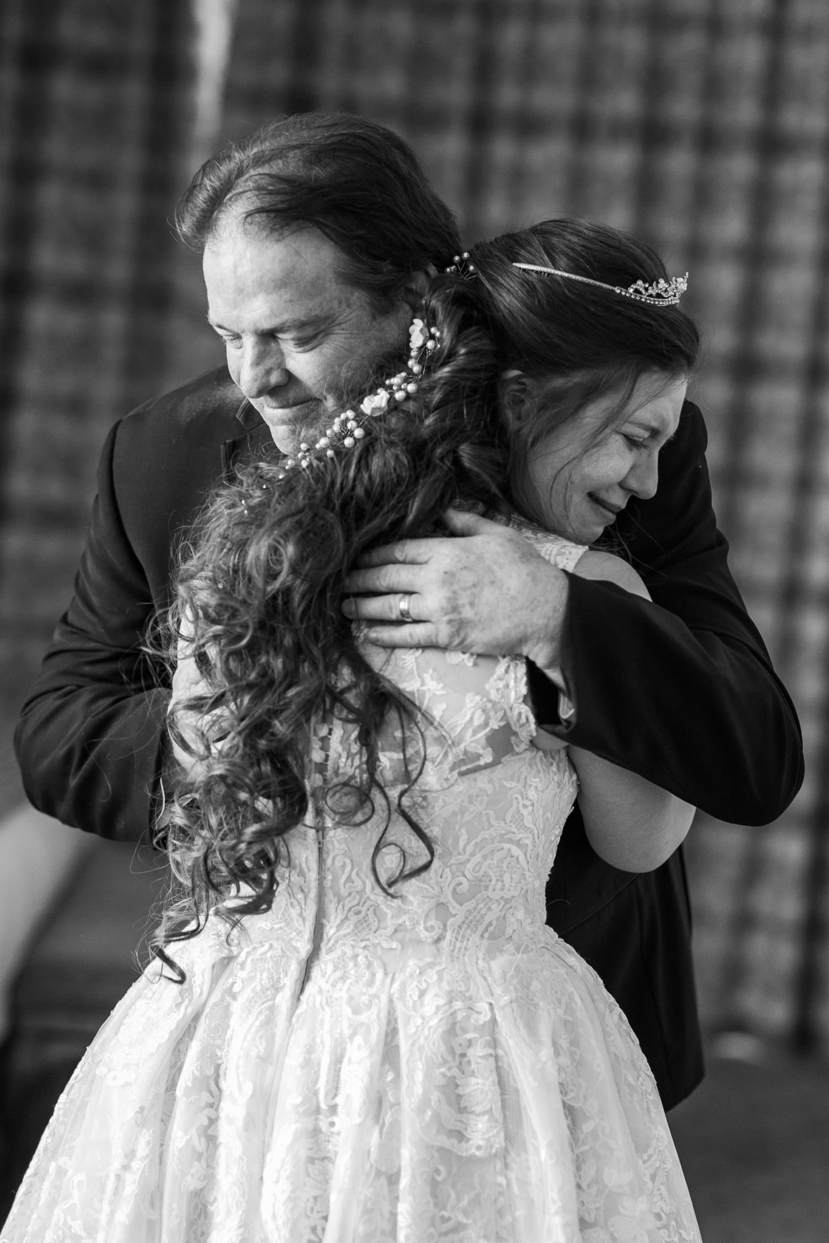 dad hugging bride