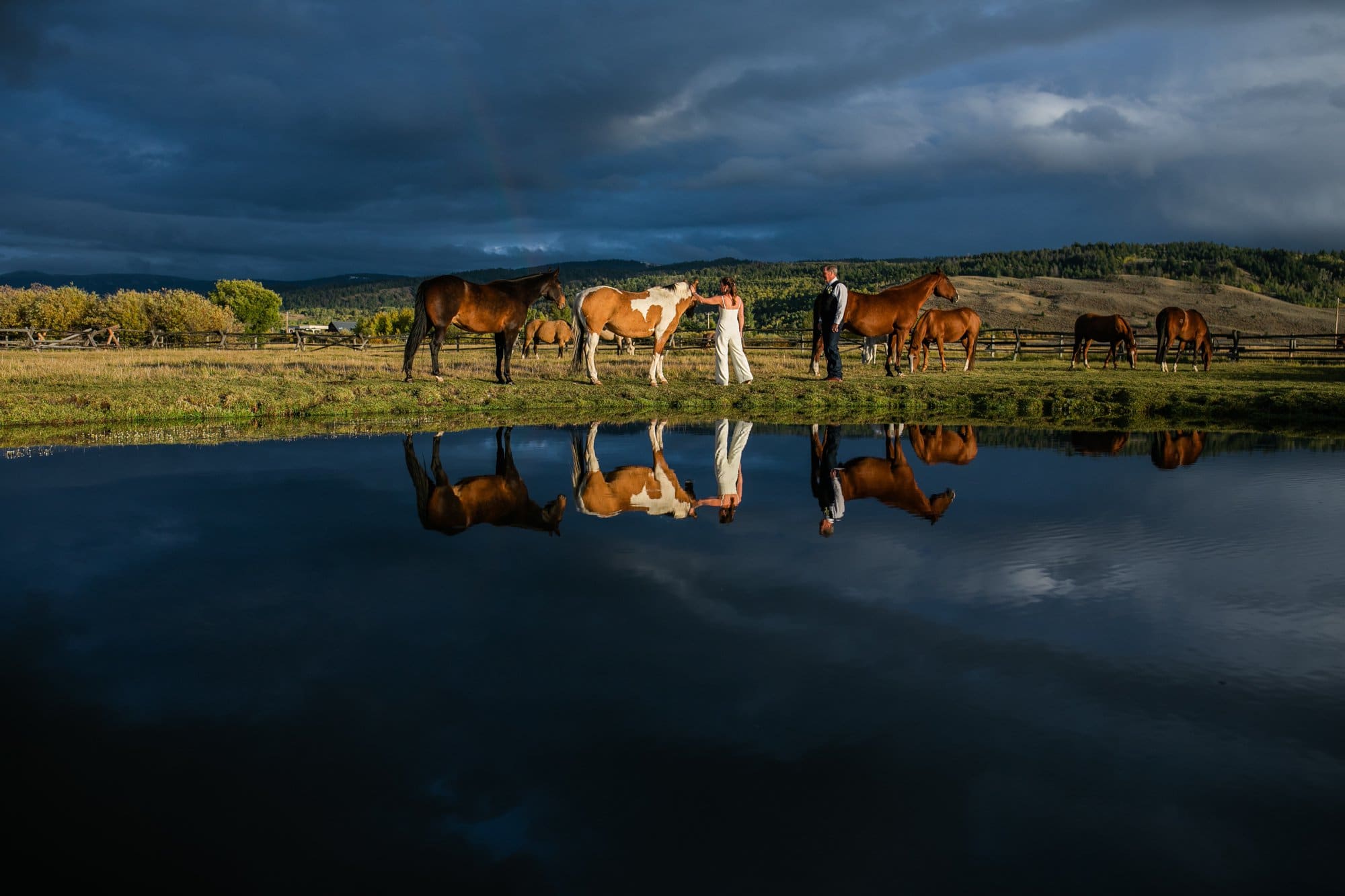 wyoming bride groom with horses and sunset