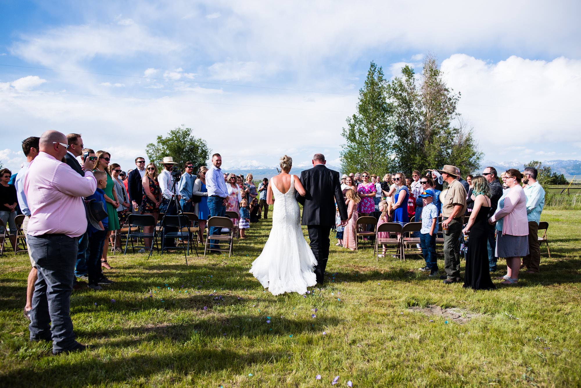 bride walking down aisle, Wyoming outdoor ceremony