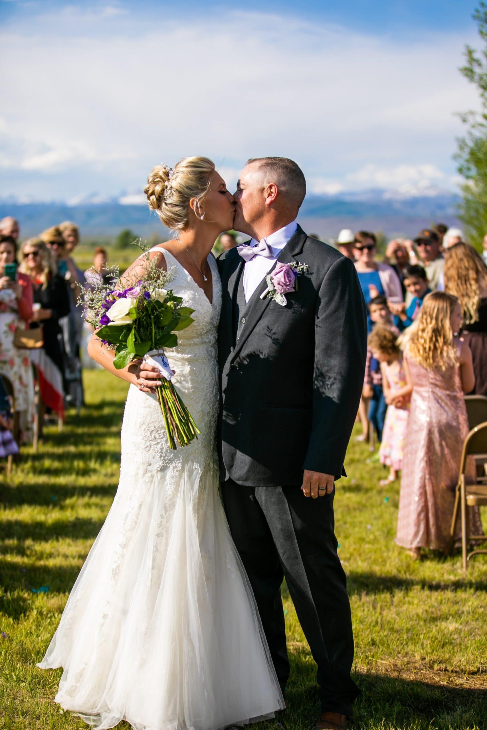 Wyoming wedding, outdoor ceremony, bride groom kissing in Pinedale