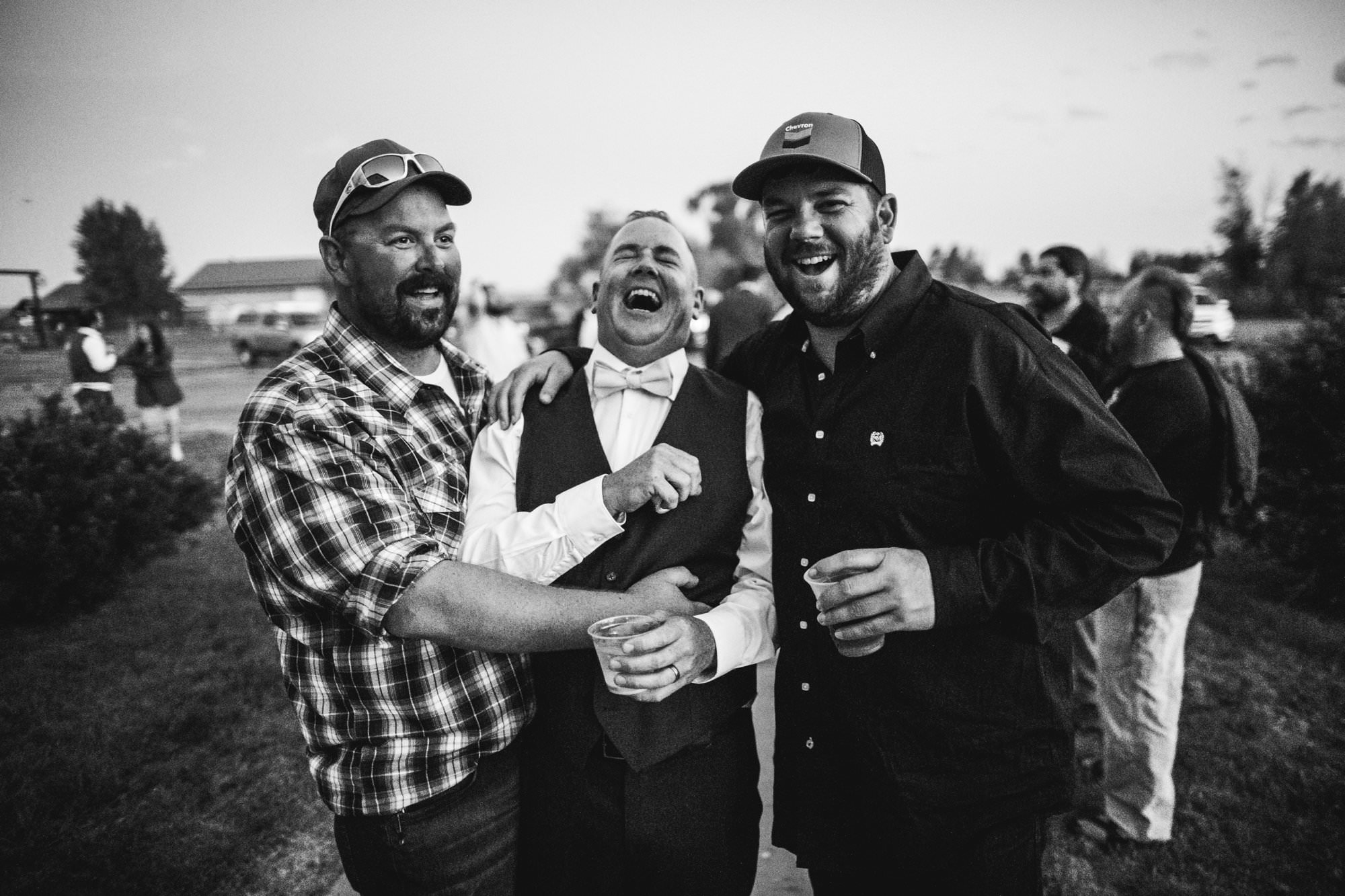 groom laughing at Wyoming reception