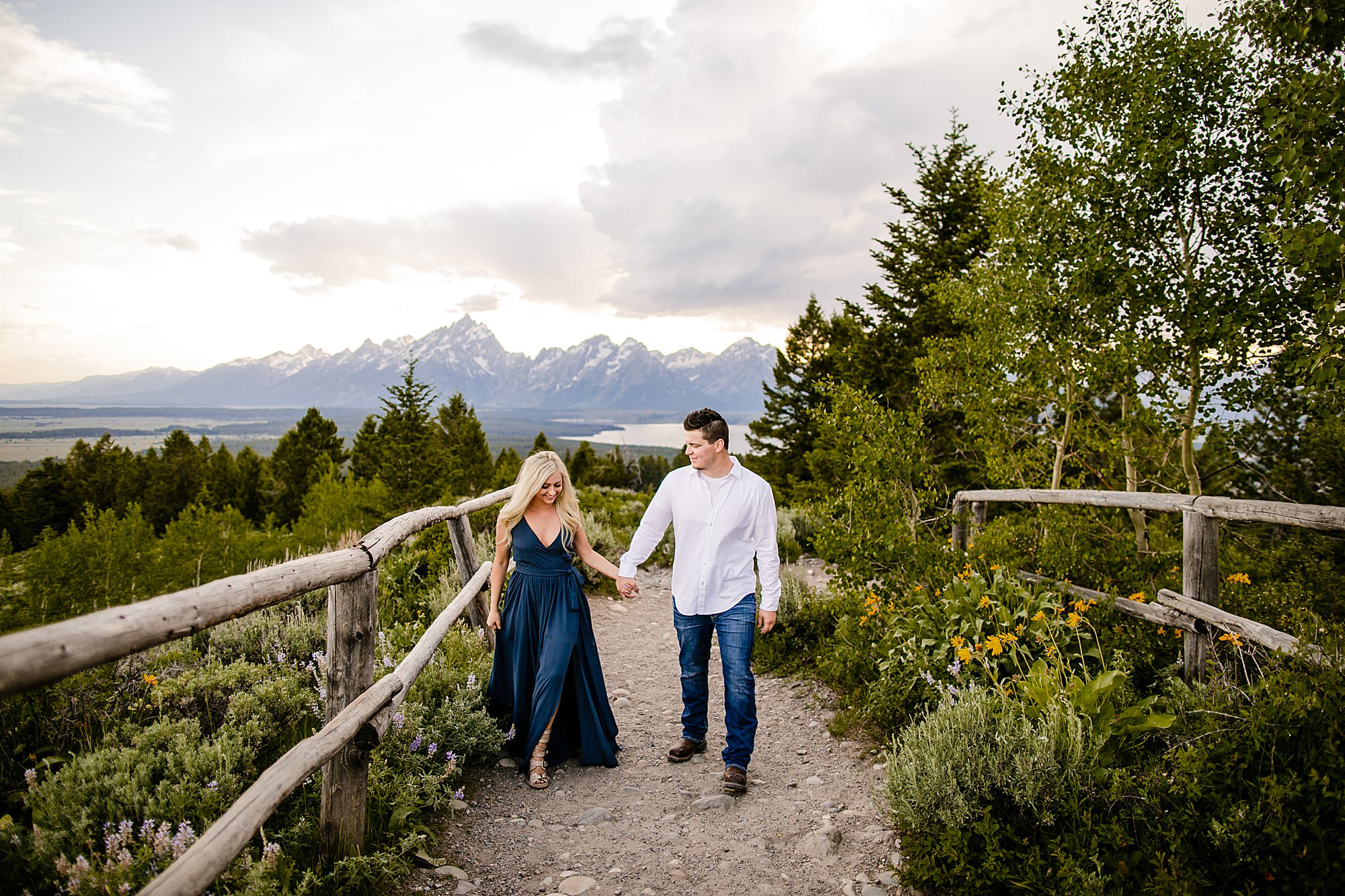 couple walking at signal mountain, grand teton national park