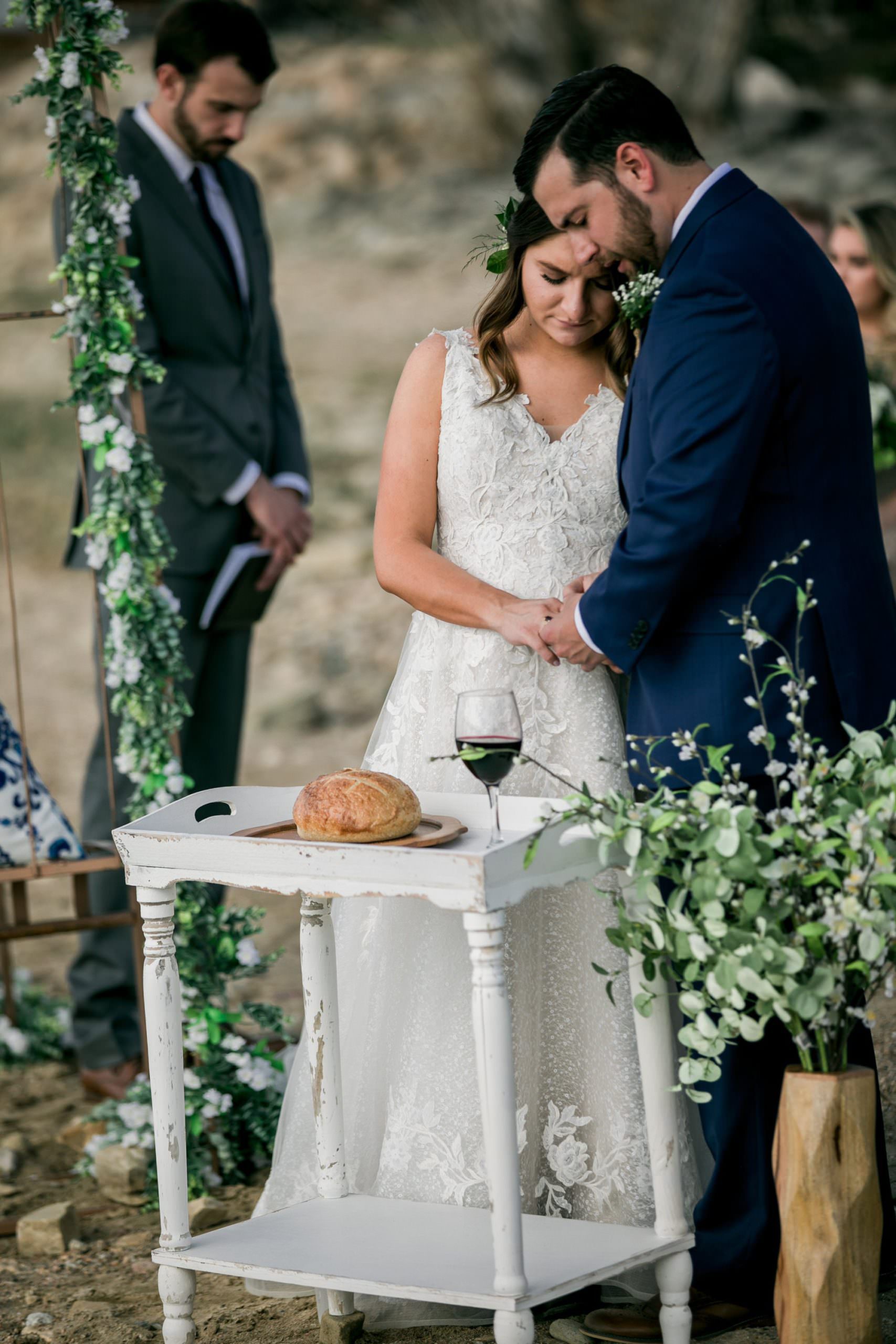 bride and groom taking communion