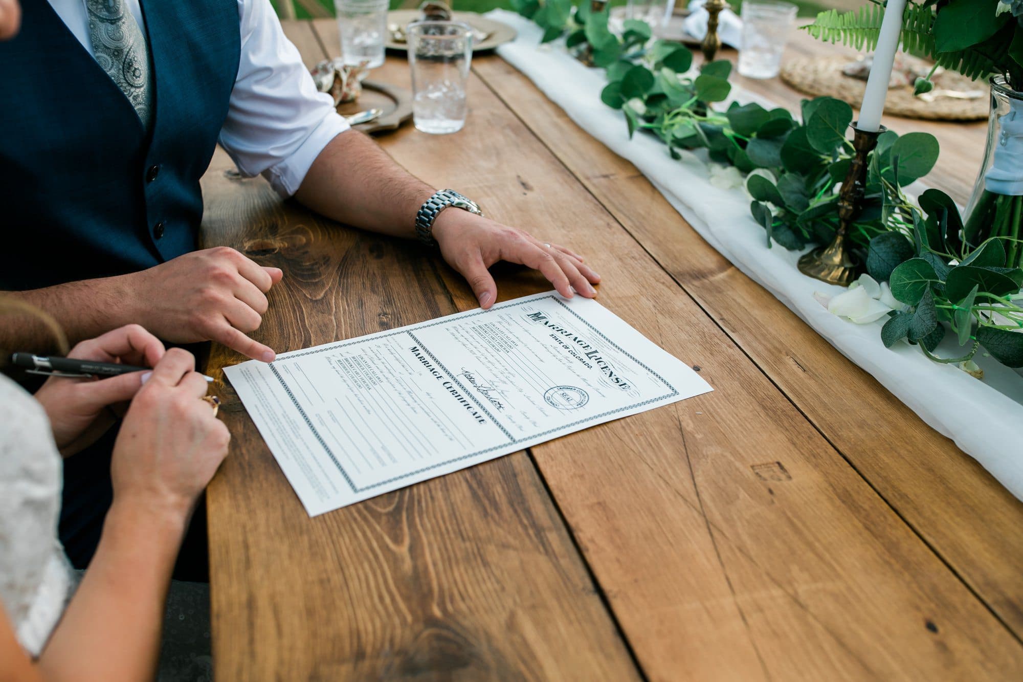 signing the marriage license, colorado