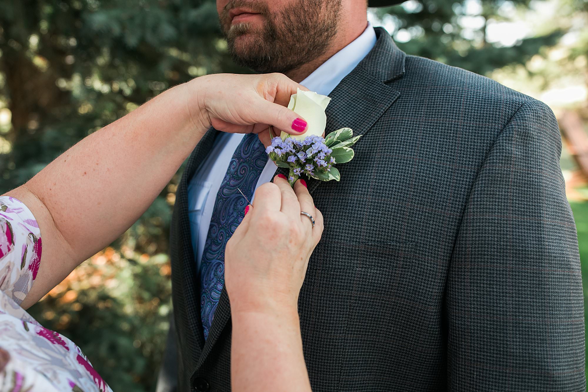 boutonniere pinning cowboy