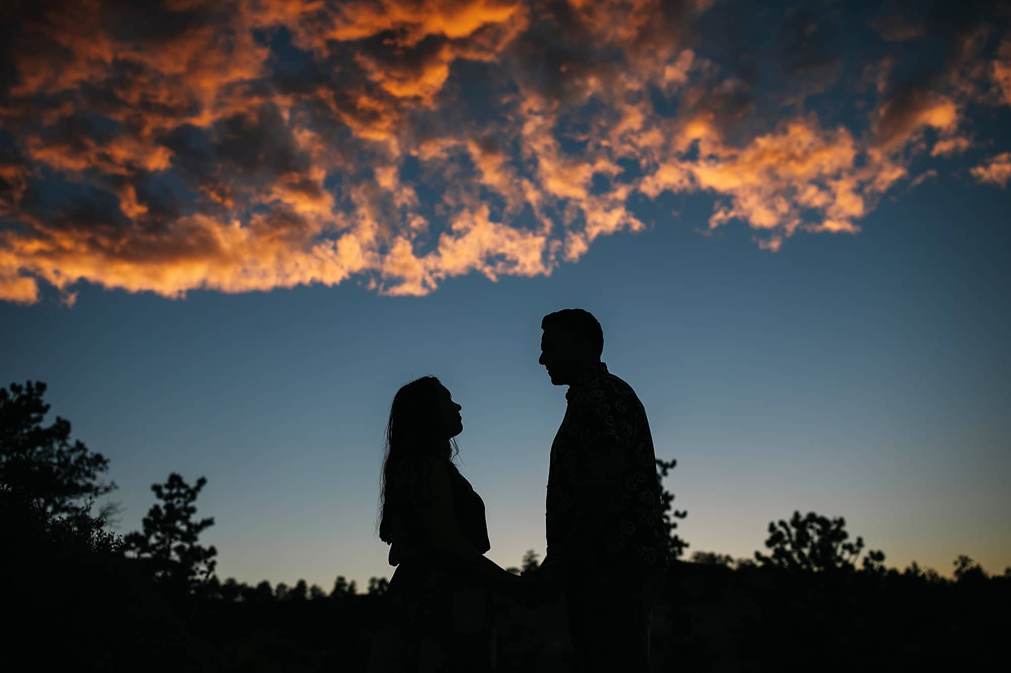 couple at sunset for engagement session